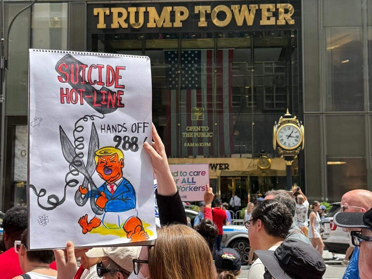 “Hands off 988!”: Protesters rally outside Trump Tower to defend LGBTQ+ crisis lifeline