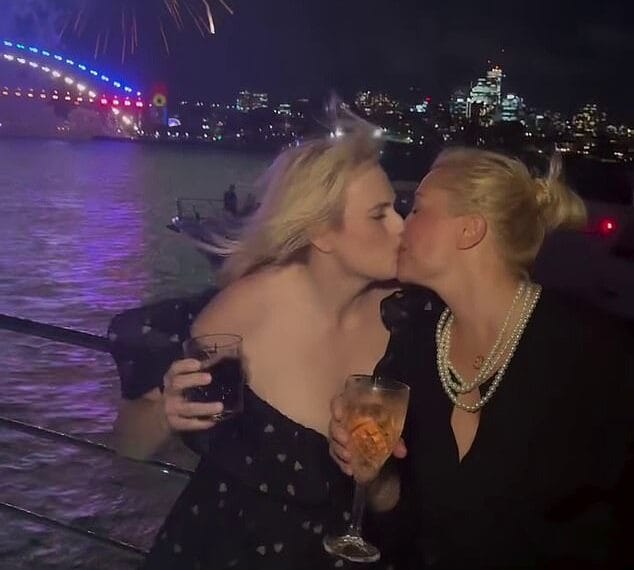 Rebel Wilson and her wife share a passionate kiss to welcome in the New Year in Australia