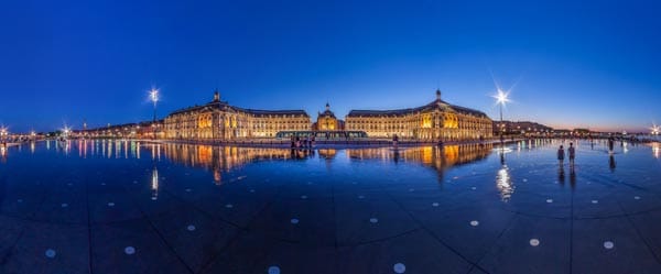A large glass of Bordeaux with a slice of Biarritz