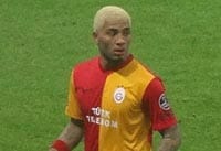 Former Albion player charged over alleged homophobic gesture