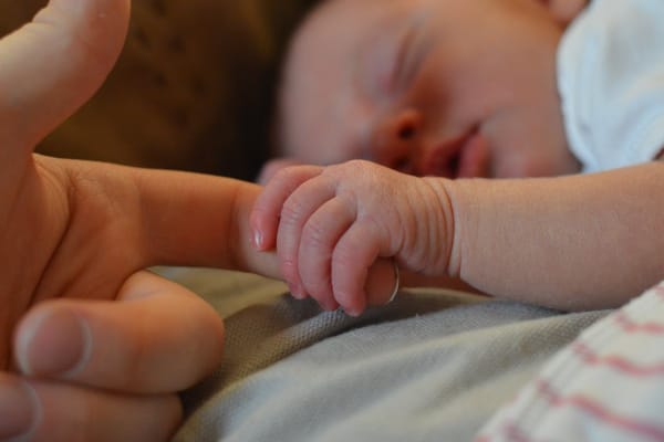UK lesbian couple welcome world’s first two-womb baby in major breakthrough