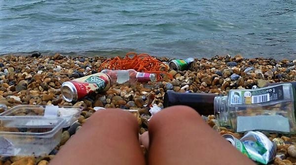 Environmentalists go naked to strip Brighton beach of rubbish
