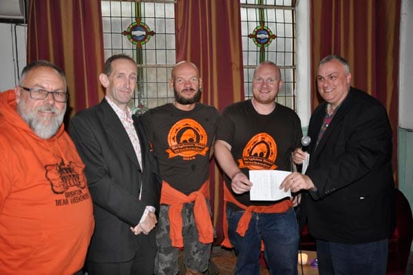 Brighton Bear Weekender present cheque to Rainbow Fund chair Paul Elgood