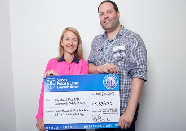 Billie Lewis receives cheque from Katy Bourne the Police & Crime Commissioner
