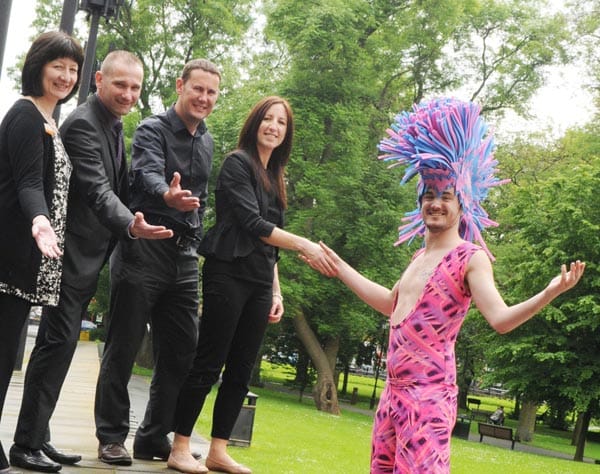 Pam Walton from the Gentoo Group, with Mark Nichols, Chair of Northern Pride, Mark Johns of South Tyneside Homes, Louise Taylor from the Gateshead Housing Company and one of the stilt walkers from the Newcastle Pride parade. 