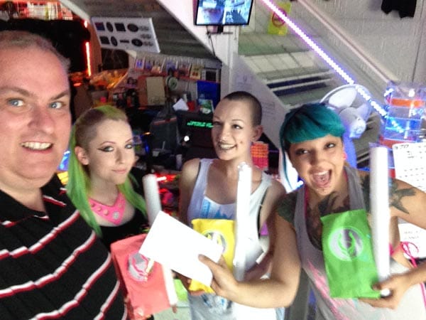 Staff at Cyber Dog, Brighton handover cheque to Paul Elgood, Chair of Rainbow Fund