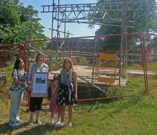 Purna Sen, Tracey Hill and Caroline Penn by the hole in Saunders Park.