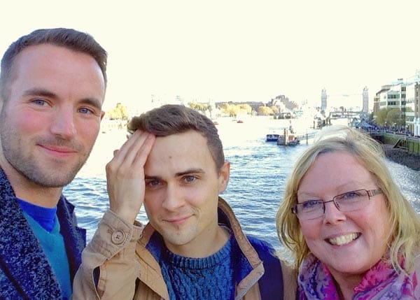 Daniel with his mum and partner Adam