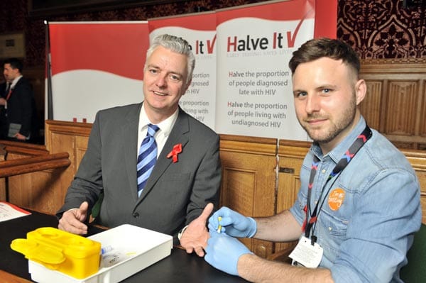 Simon Kirby MP for Brighton & Kemptown takes HIV test at 'Halve It' event in Westminster