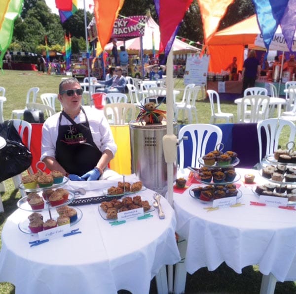 Arthur relaxes with the cakes he baked for Pride in 2016