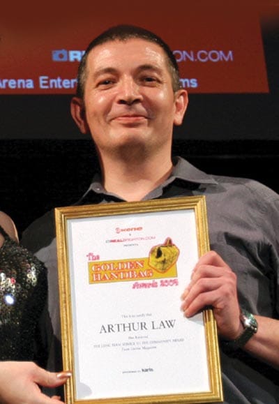 Arthur receives a Golden Handbag in 2004 for long term service to the community. He cherished the award!