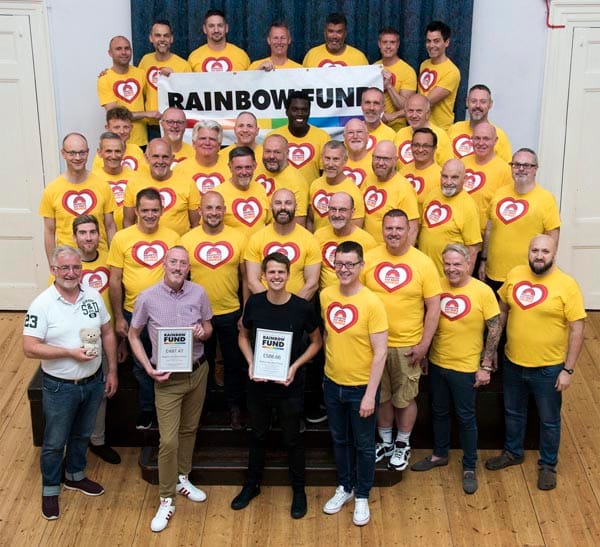 Danny Dwyer presents chorus with fundraising certificates. Photo Nick Ford photography